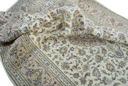 Surface texture of 2000s Kashan rug with natural Wool and intricate pattern