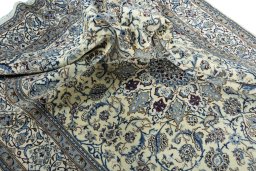 Surface texture of 2000s Nain rug with natural Wool and intricate pattern