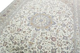 Backside of handmade 2000s Kashan rug showing knot structure and weave density