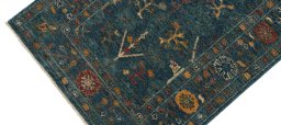 Backside of handmade New Farahan rug showing knot structure and weave density