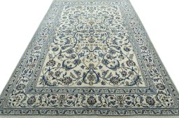 Surface texture of 2000s Nain rug with natural Wool and intricate pattern