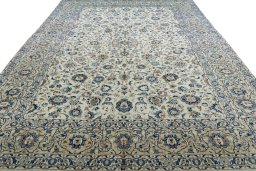 Surface texture of 2000s Kashan rug with natural Wool and intricate pattern