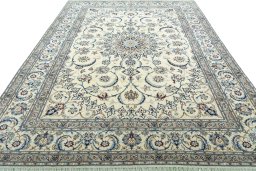 Surface texture of 2000s Nain rug with natural Wool and intricate pattern