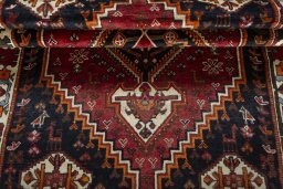 Corner detail of 2000s Shiraz rug showing border pattern and Wool pile
