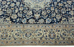 Corner detail of 2000s Nain rug showing border pattern and Wool pile