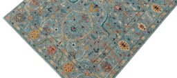 Backside of handmade New Farahan rug showing knot structure and weave density