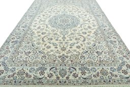 Surface texture of 2000s Nain rug with natural Wool and intricate pattern