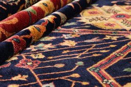 Corner detail of 1920s Agra rug showing border pattern and Wool pile