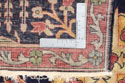Surface texture of 1920s Agra rug with natural Wool and intricate pattern
