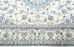 Corner detail of 2000s Nain rug showing border pattern and Wool pile