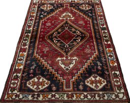 Surface texture of 2000s Shiraz rug with natural Wool and intricate pattern