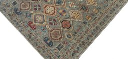 Backside of handmade New Kazak rug showing knot structure and weave density