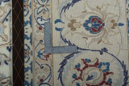 Backside of handmade 2000s Nain rug showing knot structure and weave density