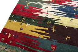 Backside of handmade 2000s Persian Gabbeh rug showing knot structure and weave density
