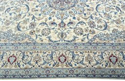 Corner detail of 2000s Nain rug showing border pattern and Wool pile