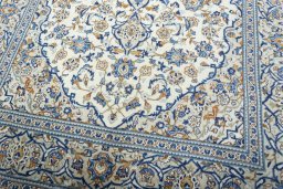 Close-up detail of 2000s Kashan rug from Iran / Persia showing Wool weave