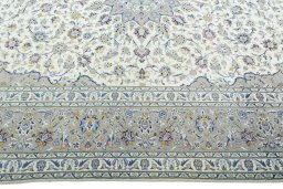 Corner detail of 2000s Kashan rug showing border pattern and Wool pile