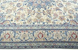 Corner detail of 2000s Nain rug showing border pattern and Wool pile