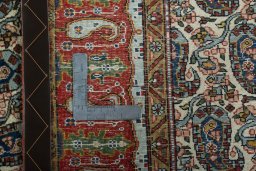 Close-up detail of 1950s Ghom rug from Iran / Persia showing Wool weave