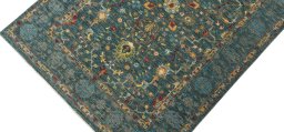 Backside of handmade New Farahan rug showing knot structure and weave density