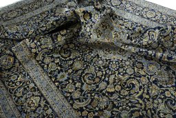 Surface texture of New Kashan rug with natural Cork and intricate pattern