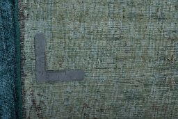 Backside of handmade 1970s Vintage rug showing knot structure and weave density