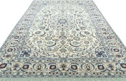Surface texture of 2000s Nain rug with natural Wool and intricate pattern