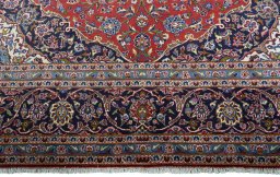 Full view of New Kashan rug from Iran / Persia, 412 × 300 cm in Red tones