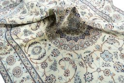 Surface texture of 2000s Nain rug with natural Wool and intricate pattern