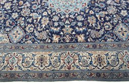 Corner detail of 2000s Nain rug showing border pattern and Wool pile