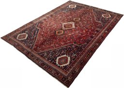 Corner detail of 2000s Shiraz rug showing border pattern and Wool pile