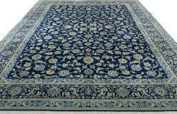 Surface texture of 2000s Kashan rug with natural Wool and intricate pattern