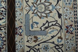 Backside of handmade 2000s Nain rug showing knot structure and weave density