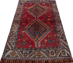 Surface texture of 2000s Shiraz rug with natural Wool and intricate pattern