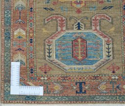 Corner detail of New Kazak rug showing border pattern and Wool pile