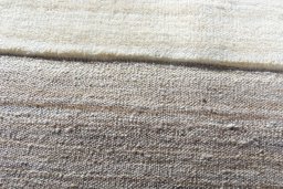 Backside of handmade New Kilim Ghashghai rug showing knot structure and weave density