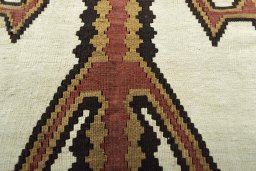 Backside of handmade 2000s Kilim Ghashghai rug showing knot structure and weave density