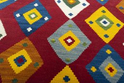 Backside of handmade New Kilim Ghashghai rug showing knot structure and weave density