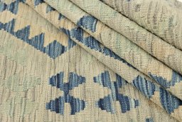 Close-up detail of New Kilim Traditional rug from Afghanistan showing Wool weave