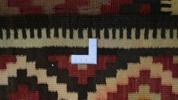 Corner detail of 1990s Kilim Traditional rug showing border pattern and Wool pile