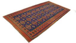 Close-up detail of New Kilim Traditional rug from Iran / Persia showing Wool weave