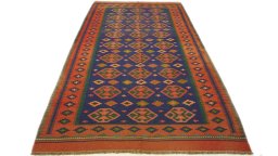 Close-up detail of New Kilim Traditional rug from Iran / Persia showing Wool weave