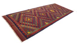 Close-up detail of New Kilim Traditional rug from Iran / Persia showing Wool weave