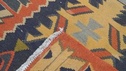 Close-up detail of 1960s Kilim Traditional rug from Iran / Persia showing Wool weave