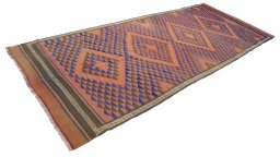 Close-up detail of New Kilim Traditional rug from Iran / Persia showing Wool weave