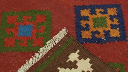 Close-up detail of New Kilim Traditional rug from Iran / Persia showing Wool weave