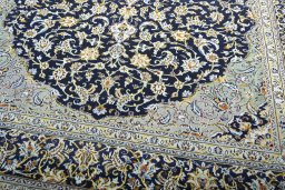 Close-up detail of 2000s Kashan rug from Iran / Persia showing Wool weave