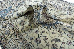 Surface texture of 2000s Nain rug with natural Wool and intricate pattern