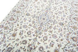 Backside of handmade New Kashan rug showing knot structure and weave density