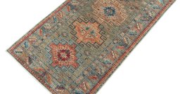 Backside of handmade New Kazak rug showing knot structure and weave density